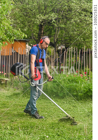 lawn trimming with hand mower. High quality photo lawn trimming with hand mower. High quality photo 108025831