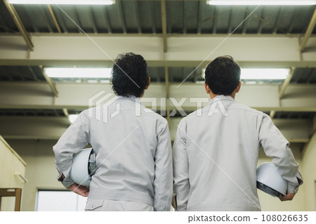 two middle-aged workers two middle-aged workers 108026635