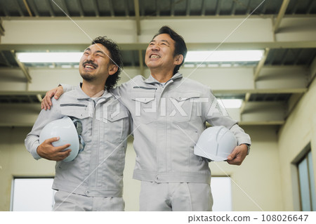 two middle-aged workers two middle-aged workers 108026647