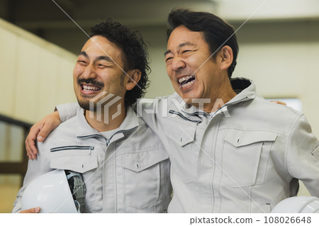 two middle-aged workers two middle-aged workers 108026648