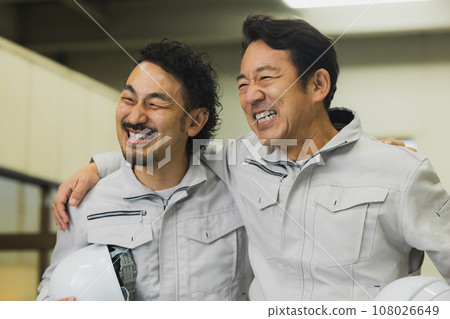 two middle-aged workers two middle-aged workers 108026649