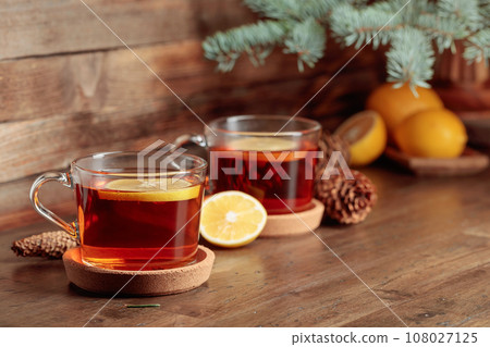 Tea with lemon on a wooden table. 108027125