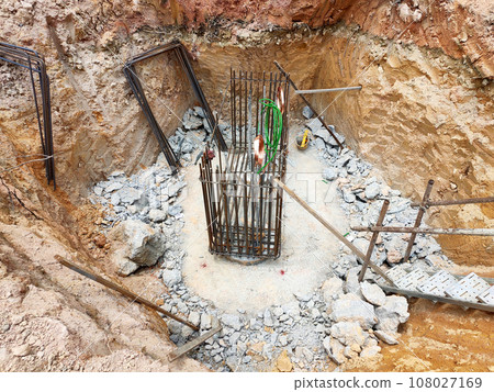 JOHOR, MALAYSIA - SEPTEMBER 03, 2020: Bore pile that has been driven into the ground and reached the required depth. It will be cut and then a pile cap will be built over it. JOHOR, MALAYSIA - SEPTEMBER 03, 2020: Bore pile that has been driven into the ground and reached the required depth. It will be cut and then a pile cap will be built over it. 108027169