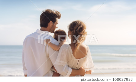 Parent holding a toddler between each other. Standing in front of the beach with clear blue sky. Generative AI. 108027953