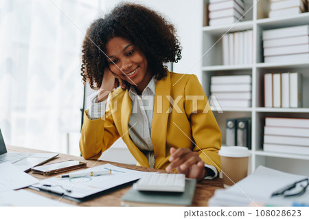 Young asian female work with financial papers at home count on calculator before paying taxes receipts online, planning budget glad to find chance for economy saving money, audit concepts 108028623