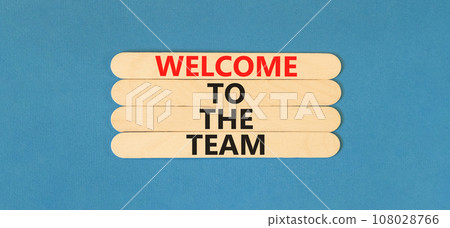 Welcome to the team symbol. Concept words Welcome to the team on beautiful wooden stick. Beautiful blue table blue background. Business, motivational and welcome to the team concept. 108028766