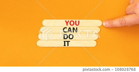 You can do it symbol. Concept word You can do it on beautiful wooden stick. Beautiful orange table orange background. Businessman hand. Business motivational you can do it concept. Copy space. 108028768