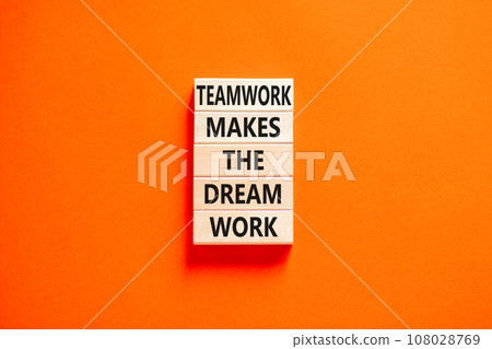 Teamwork makes the dream work symbol. Concept words Teamwork makes the dream work on wooden blocks on a beautiful orange table orange background. Business Teamwork makes dream work concept. Copy space 108028769