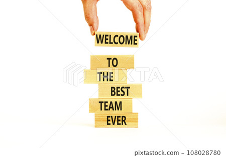 Welcome to best team symbol. Concept words Welcome to the best team ever on wooden block. Beautiful white table background. Businessman hand. Business motivational and welcome to best team concept Welcome to best team symbol. Concept words Welcome to the best team ever on wooden block. Beautiful white table background. Businessman hand. Business motivational and welcome to best team concept 108028780