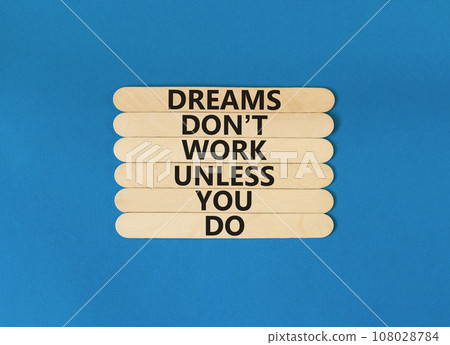 Dream and do symbol. Wooden blocks with words Dreams do not work unless you do. Beautiful blue table blue background. Business, motivational dream and do concept. 108028784