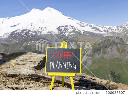 Career planning symbol. Concept words Career planning on beautiful black chalk blackboard. Beautiful mountain Elbrus blue sky background. Business, motivational career planning concept. Copy space. 108028807