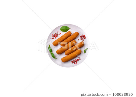 Delicious crispy cheese sticks with mozzarella, salt and spices, breaded and fried in oil 108028950