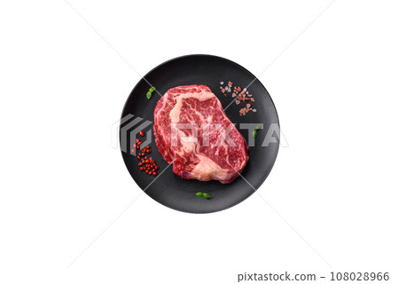 Fresh juicy raw beef striploin steak with salt and spices Fresh juicy raw beef striploin steak with salt and spices 108028966