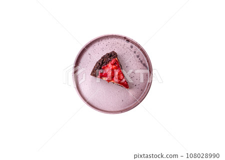Beautiful tasty sweet slice of cheesecake with cherry on a ceramic plate Beautiful tasty sweet slice of cheesecake with cherry on a ceramic plate 108028990
