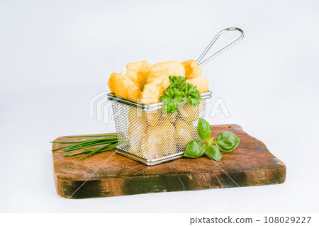 Breaded Chicken Inner Fillet on a White Background,Chicken Breaded Raw Meat.Chicken Breaded Fillet. Breaded chicken nuggets. Fast homemade food at home. Chicken breaded schnitzels. Fast cooking. 108029227