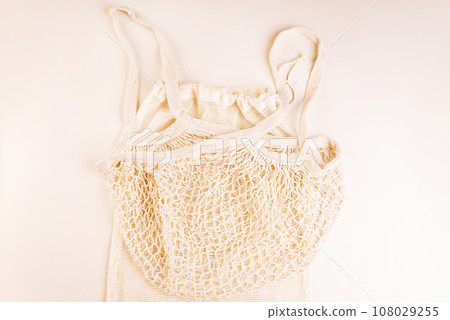 Eco Bags.A variety of eco bags on a yellow background . Sustainable lifestyle.Zero waste minimal composition with tring and canvas bags for storage.Zero waste, eco friendly shopping.Top view,flat lay. 108029255