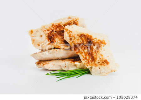 Fast food. Chicken fillets fried until half cooked, semi-finished product on a white background. Quick cooking at home. Copy space.Fast cooking.Fast homemade food. 108029374