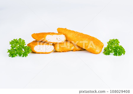 Breaded Chicken Inner Fillet on a White Background,Chicken Breaded Raw Meat.Chicken Breaded Fillet. Breaded chicken nuggets. Fast homemade food at home. Chicken breaded schnitzels. Fast cooking. 108029408