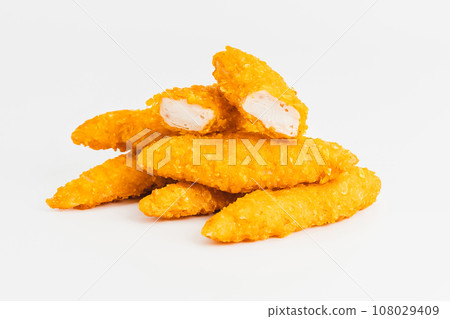 Breaded Chicken Inner Fillet on a White Background,Chicken Breaded Raw Meat.Chicken Breaded Fillet. Breaded chicken nuggets. Fast homemade food at home. Chicken breaded schnitzels. Fast cooking. Breaded Chicken Inner Fillet on a White Background,Chicken Breaded Raw Meat.Chicken Breaded Fillet. Breaded chicken nuggets. Fast homemade food at home. Chicken breaded schnitzels. Fast cooking. 108029409