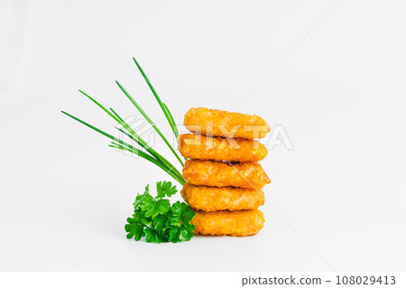 Breaded Chicken nuggets Fillet with salad on a White Background,food at home. Fast homemade food.Chicken breaded schnitzels. Breaded Chicken Inner Fillet, Chicken Breaded Raw Meat. Fast cooking. 108029413