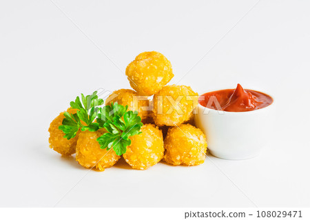 Breaded Chicken Inner Fillet on a White Background,Chicken Breaded Raw Meat.Chicken Breaded Fillet. Breaded chicken nuggets. Fast homemade food at home. Chicken breaded schnitzels. Fast cooking. 108029471