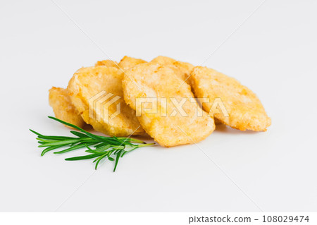 Breaded Chicken nuggets Fillet with salad on a White Background,food at home. Fast homemade food.Chicken breaded schnitzels. Breaded Chicken Inner Fillet, Chicken Breaded Raw Meat. Fast cooking. 108029474