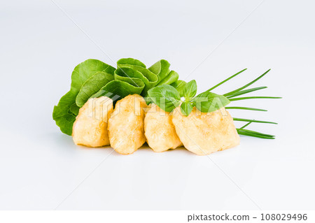 Breaded Chicken Inner Fillet with green lettuce leaves on a White Background,Chicken Breaded Raw Meat,Fillet.Breaded chicken nuggets. Fast homemade food at home.Chicken breaded schnitzels.Fast cooking Breaded Chicken Inner Fillet with green lettuce leaves on a White Background,Chicken Breaded Raw Meat,Fillet.Breaded chicken nuggets. Fast homemade food at home.Chicken breaded schnitzels.Fast cooking 108029496