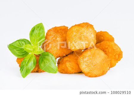Chicken Breaded Fillet. Breaded chicken nuggets. Fast homemade food at home. Chicken breaded schnitzels. Breaded Chicken Inner Fillet on a White Background,Chicken Breaded Raw Meat. Fast cooking. 108029510