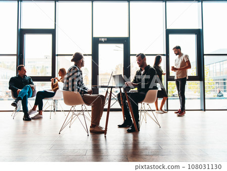 Business people that work together in office. Concept of teamwork and partnership Business people that work together in office. Concept of teamwork and partnership 108031130