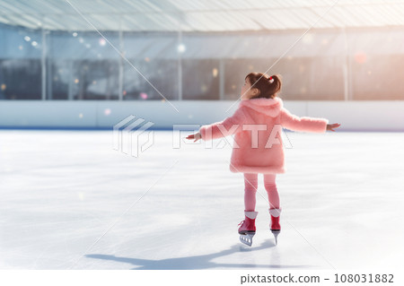Happy Asian little girl having fun and skating on outdoor skating rink, back view Happy Asian little girl having fun and skating on outdoor skating rink, back view 108031882