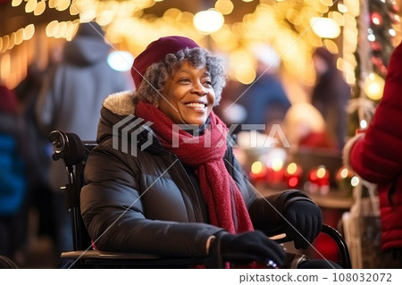 African American elderly woman in wheelchair having fun And walk around Christmas fair in festively decorated city 108032072