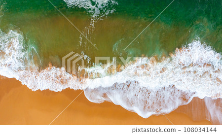 Wave on the beach with sand and turquoise waves Wave on the beach with sand and turquoise waves 108034144
