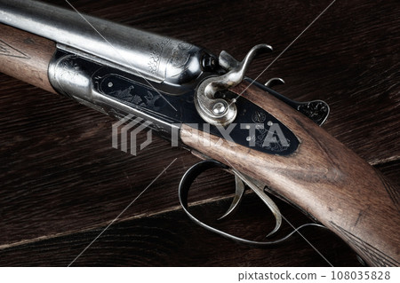 Antique 12-gauge break-action smooth-bored shotgun. 108035828