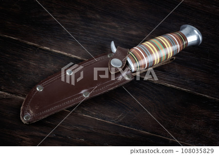 Vintage hunting knife with leather holster 108035829