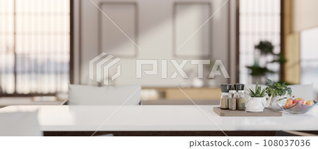 Copy space on a luxury white dining table with a blurred background of a modern white kitchen. 108037036