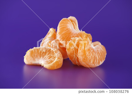 Group of tangerine slices over blue background Group of tangerine slices over blue background 108038276