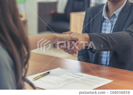 Team Business Partners shaking hands together to Greeting Start up small business in meeting room. Shakehand teamwork partners at modern office handshake together. Business mergers and acquisitions 108038858