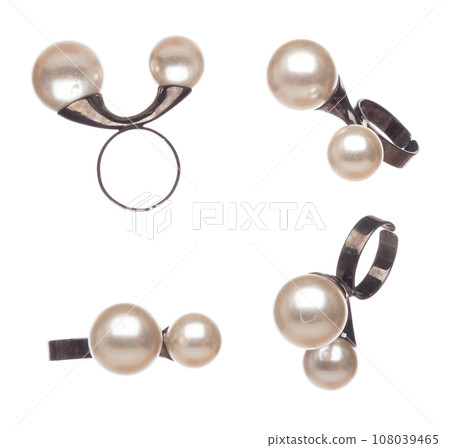 Fashion shinny pearl colorful Ring with beautiful work detail is value. Luxury precious pearl Ring is fashion trend and fly in air. White background isolated 108039465