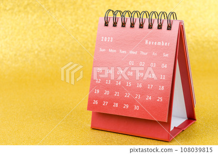 The Red November 2023 Monthly desk calendar for 2023 year on golden color background. 108039815