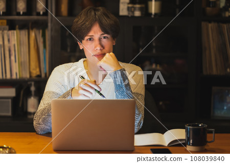 man using computer at night man using computer at night 108039840