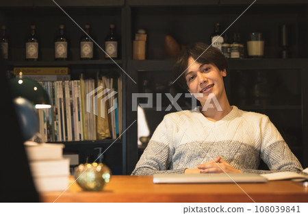 man relaxing at night man relaxing at night 108039841