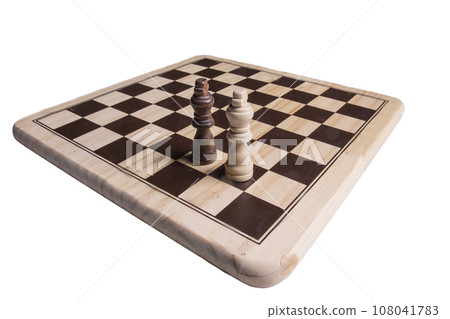 chessmen arranged on a chessboard chessmen arranged on a chessboard 108041783