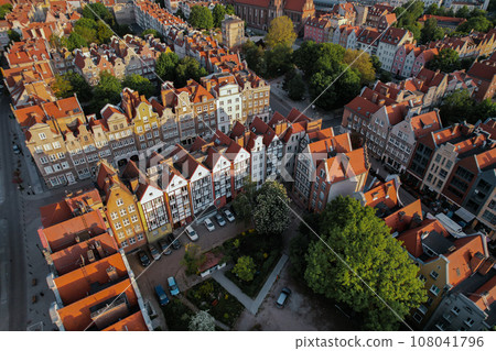 Beautiful panoramic architecture of old town in Gdansk, Poland at sunrise. Aerial view drone pov. Landscape cityscape City from Above. Small vintage historical buildings Europe Tourist Attractions Beautiful panoramic architecture of old town in Gdansk, Poland at sunrise. Aerial view drone pov. Landscape cityscape City from Above. Small vintage historical buildings Europe Tourist Attractions 108041796
