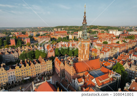 St Mary's Cathedral Beautiful panoramic architecture of old town in Gdansk, Poland at sunrise. Aerial view drone pov. Landscape cityscape City from Above. Small vintage historical buildings Europe 108041801