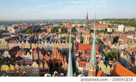 St Mary's Cathedral Beautiful panoramic architecture of old town in Gdansk, Poland at sunrise. Aerial view drone pov. Landscape cityscape City from Above. Small vintage historical buildings Europe St Mary's Cathedral Beautiful panoramic architecture of old town in Gdansk, Poland at sunrise. Aerial view drone pov. Landscape cityscape City from Above. Small vintage historical buildings Europe 108041819