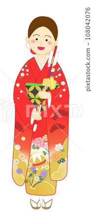 Smiling woman wearing a red furisode and holding a hamaya 108042076