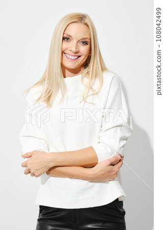 Beautiful cute woman hugs herself Beautiful cute woman hugs herself 108042499