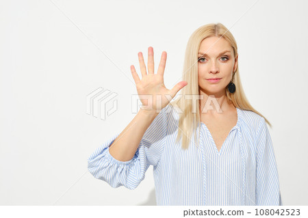 Woman shows five fingers. Counting with fingers. Woman shows five fingers. Counting with fingers. 108042523