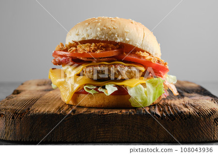 Burger beef demi glace on wooden background, front view 108043936