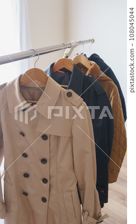 Hanging a coat on a hanger | Image of organizing, changing clothes, etc. 108045044